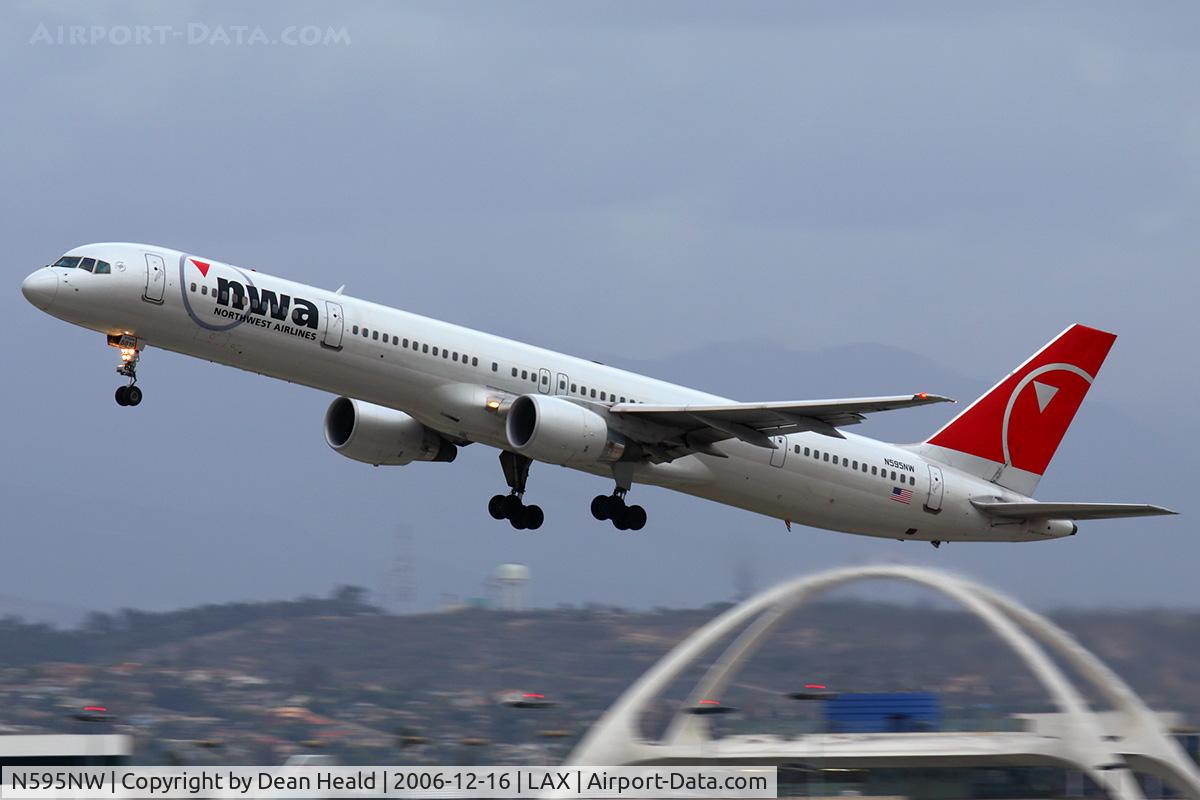 N595NW, 2003 Boeing 757-351 C/N 32995, Northwest Airlines N595NW (FLT NWA91) climbing out from RWY 25R on a cold, stormy afternoon enroute to Honolulu Int'l (PHNL).