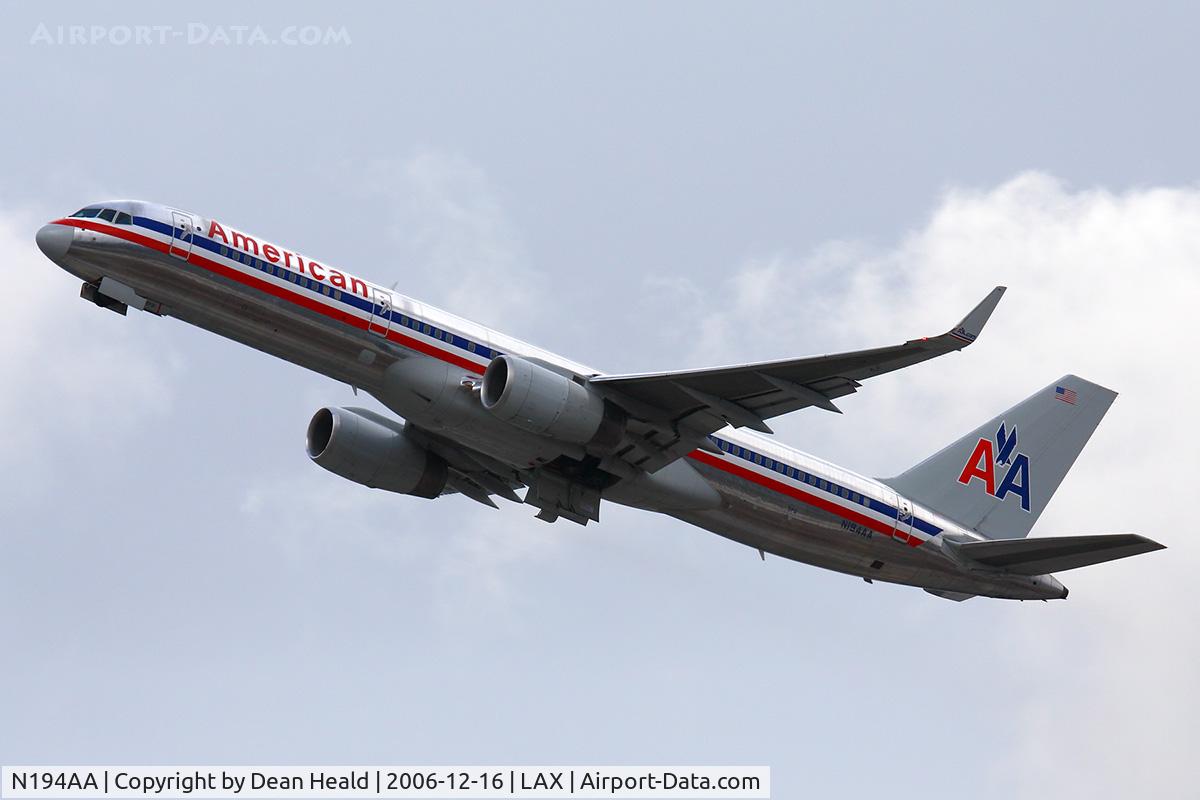 N194AA, 2001 Boeing 757-223 C/N 32388, American Airlines N194AA (FLT AAL164) climbing out from RWY 25R on a cold, stormy afternoon enroute to Newark/New York Liberty Int'l (KEWR).