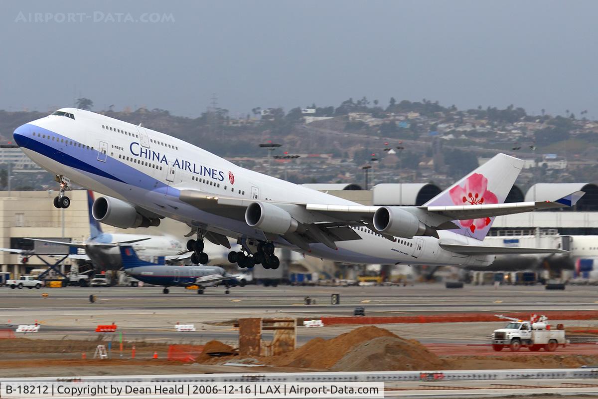 B-18212, 2005 Boeing 747-409 C/N 33736, China Airlines B-18212 (FLT CAL5) departing RWY 25R on a cold, stormy afternoon enroute to Chiang Kai Shek Int'l (RCTP) - Taipei, Taiwan.