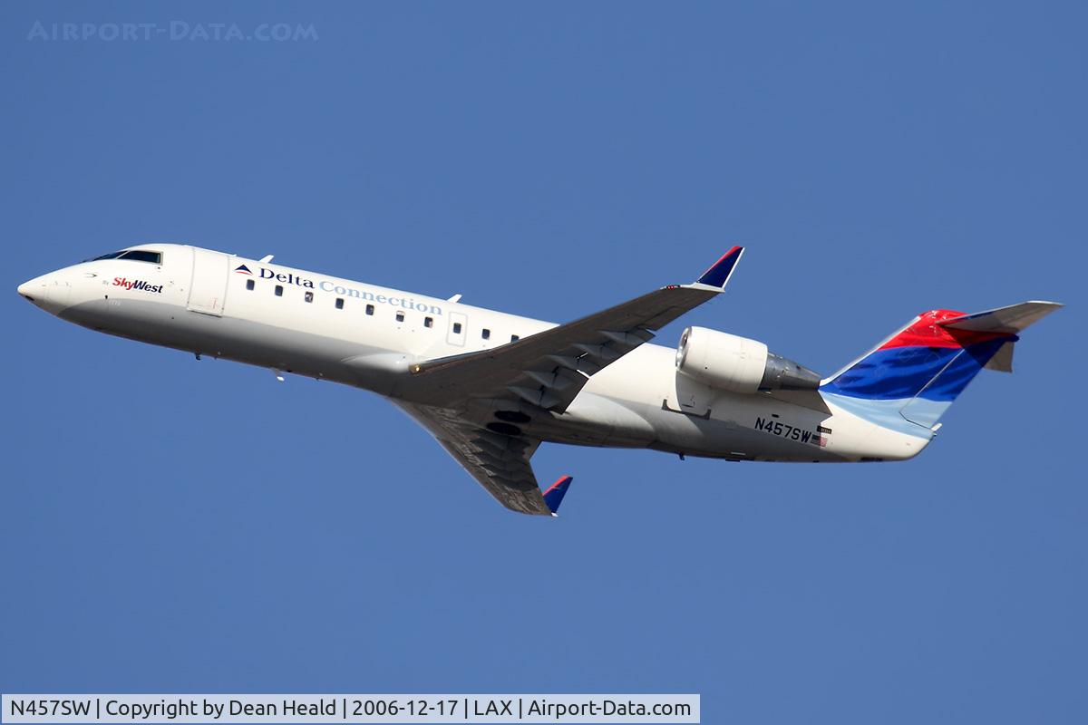 N457SW, 2003 Canadair CL-600-2B19 Regional Jet CRJ-200LR C/N 7773, Delta Connection (operated by SkyWest Airlines) N457SW (FLT SKW3974) climbing out from RWY 24L enroute to Salt Lake City Int'l (KSLC).
