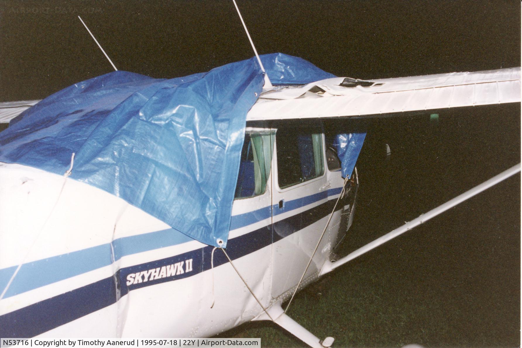 N53716, Cessna 172P C/N 17274806, the left wing brushed the runway followed by the right wing making harder contact. The airplane then 
