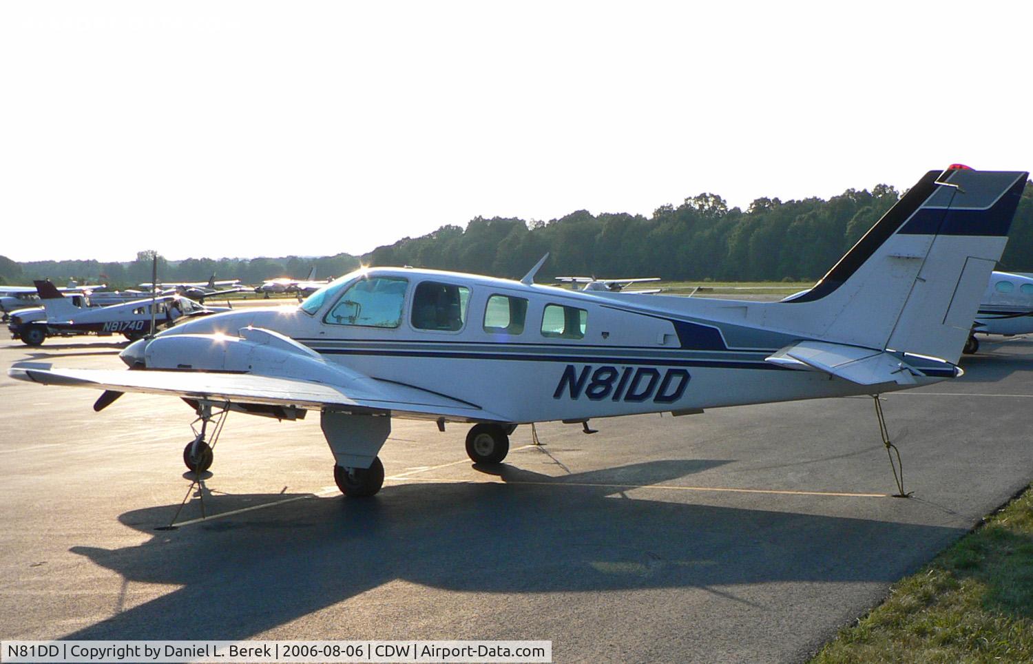N81DD, 1980 Beech 58 Baron C/N TH-1212, A 1980 Beech Baron casts a long shadow at Caldwell.