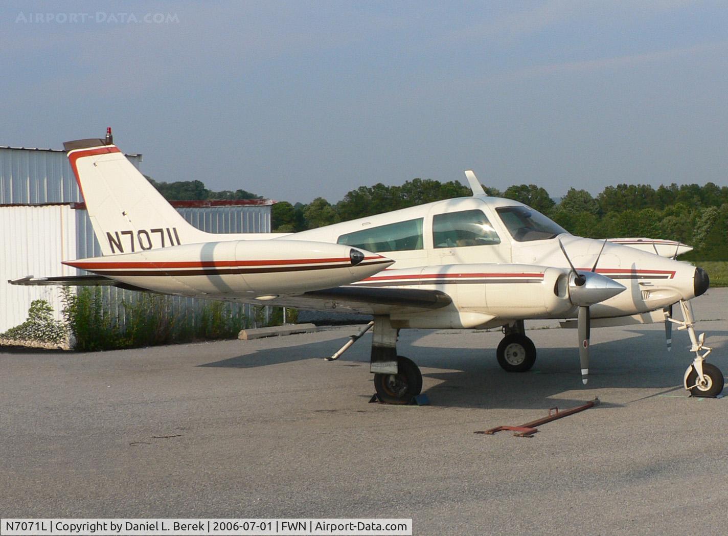 N7071L, 1966 Cessna 310K C/N 310K0171, A sporty 1966-era Cessna twin awaits mechanical attention at Sussex Airport.