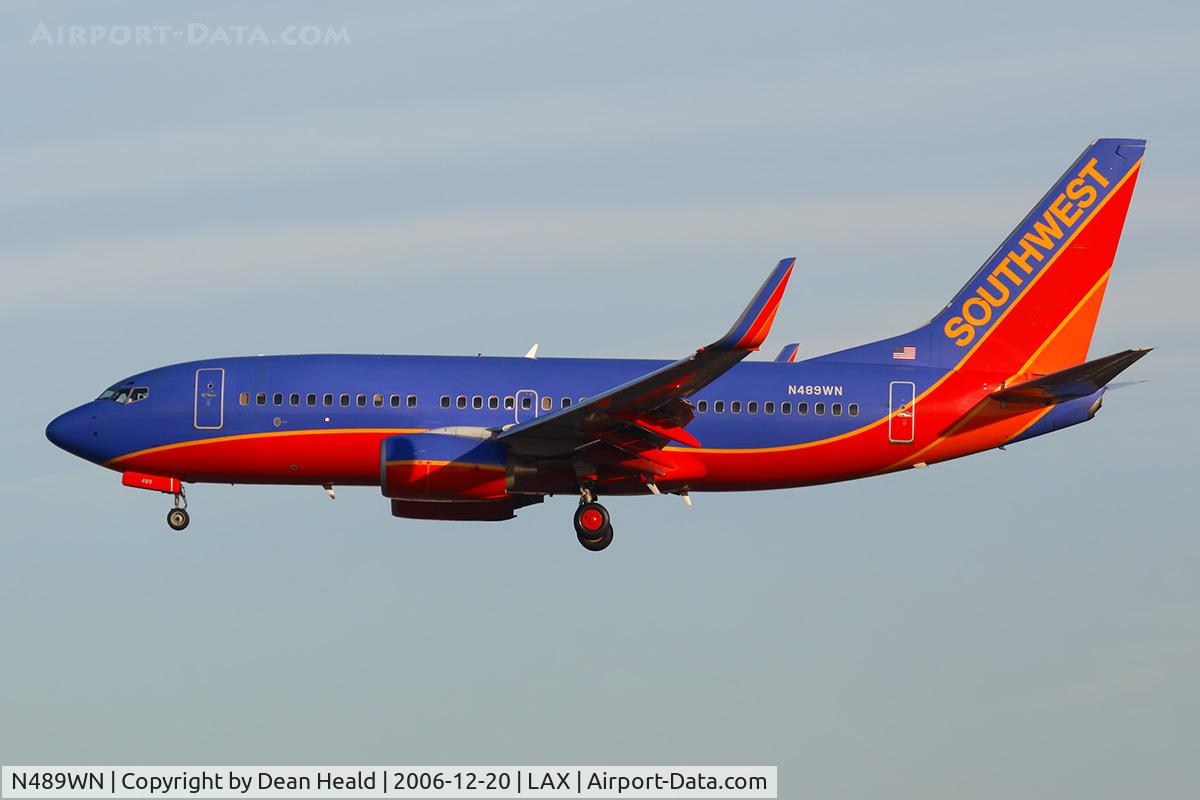 N489WN, 2004 Boeing 737-7H4 C/N 33855, Southwest Airlines N489WN (FLT SWA569) from Tucson Int'l on short final to RWY 25R early in the morning.