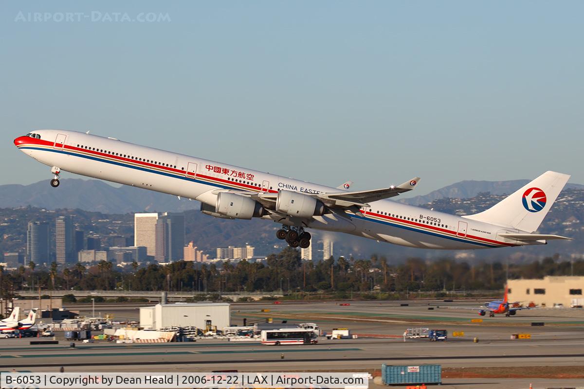 B-6053, 2004 Airbus A340-642 C/N 577, Running late today, China Eastern B-6053 (FLT CES586) climbing out from RWY 25R enroute to Shanghai Pudong (ZSPD).