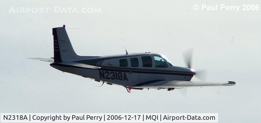 N2318A, 1997 Raytheon Aircraft Company A36 Bonanza C/N E-3118, Yet another angle, drenched in the low sun