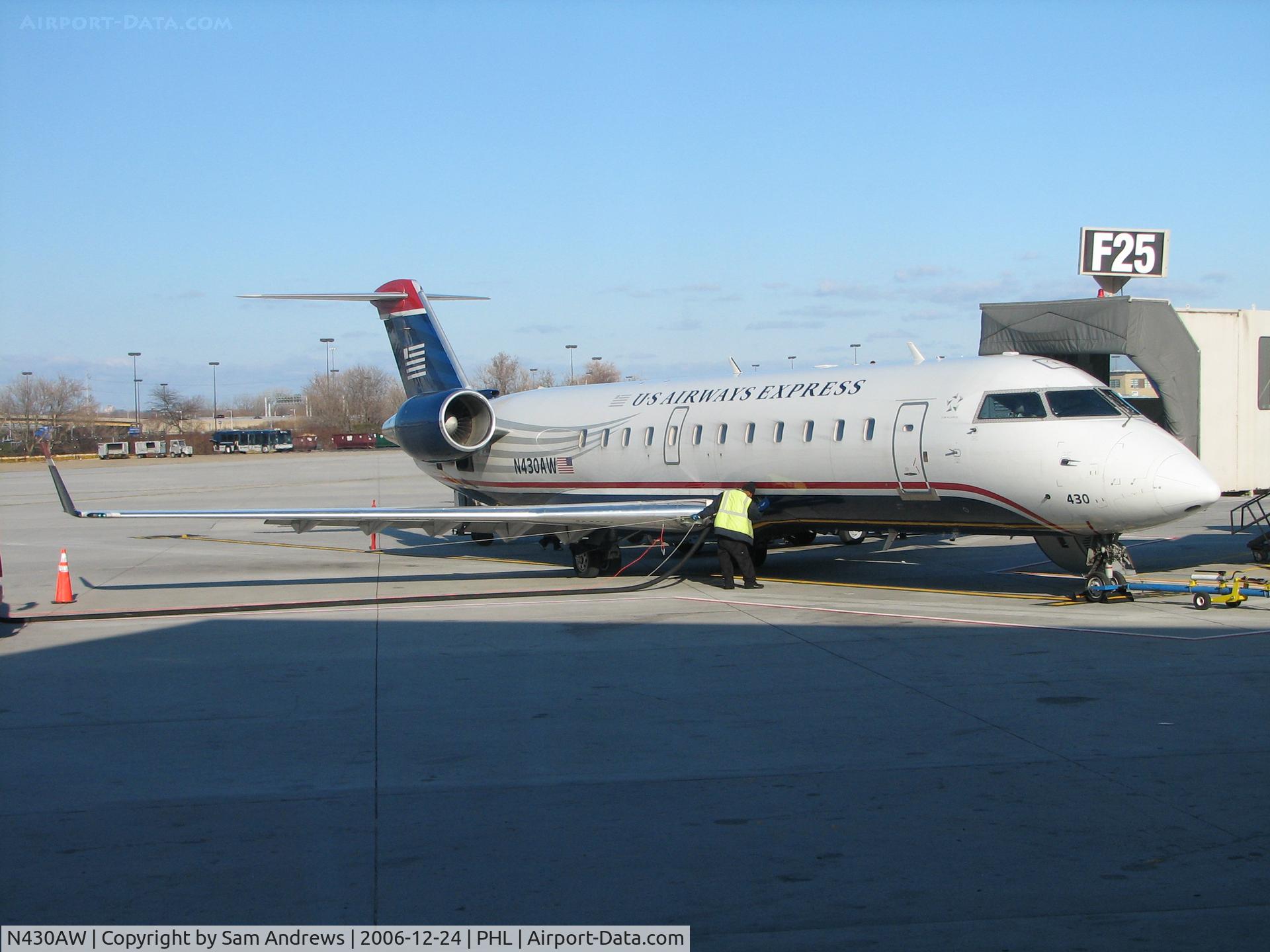 N430AW, 2002 Bombardier CRJ-200LR (CL-600-2B19) C/N 7719, Getting a drink