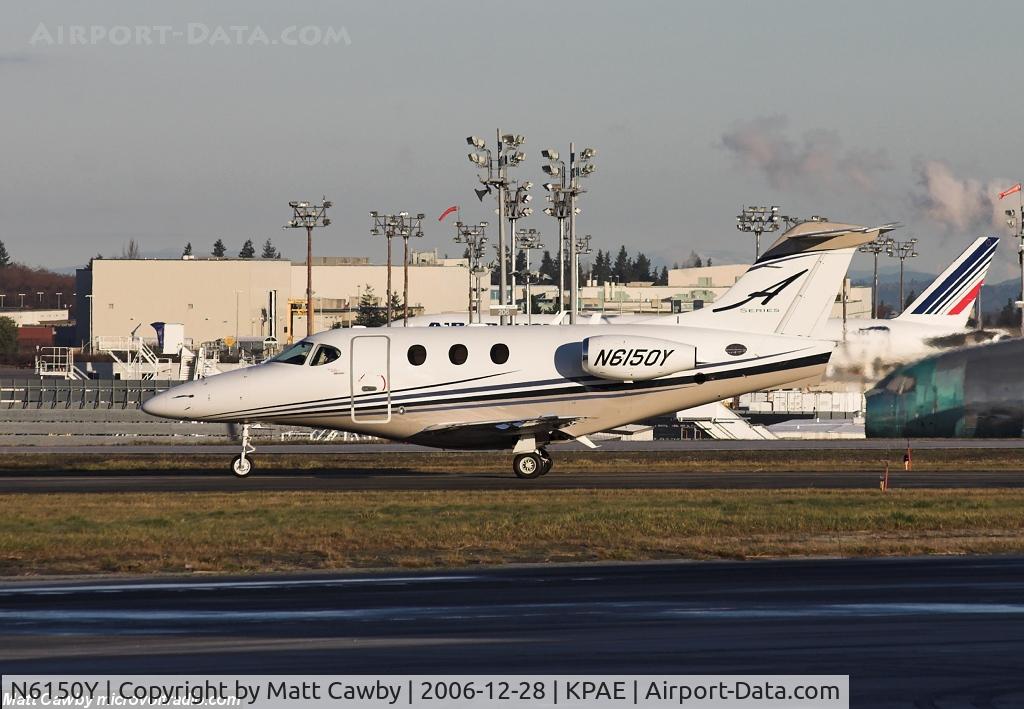 N6150Y, 2006 Raytheon Aircraft Company 390 C/N RB-150, New Air France 777 F-GSQS in the background