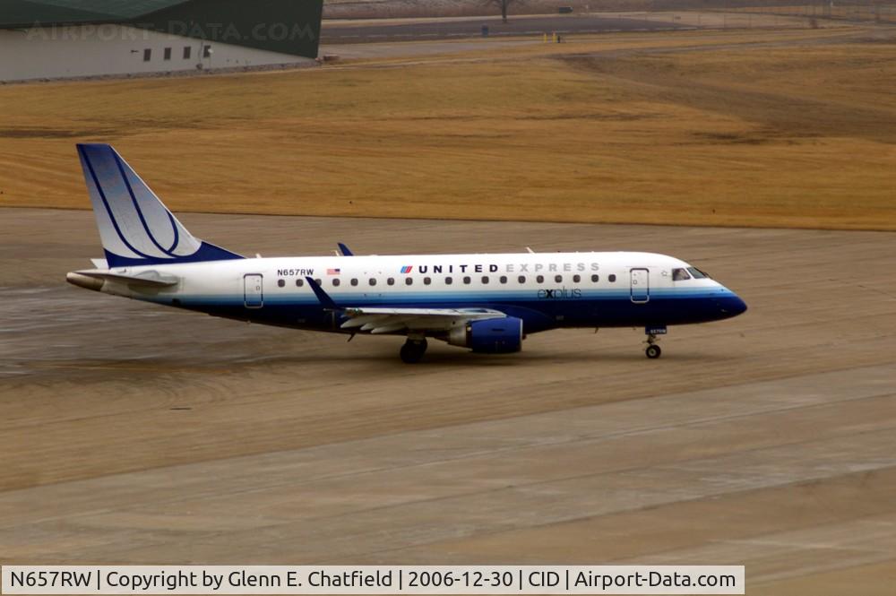 N657RW, 2005 Embraer 170SE (ERJ-170-100SE) C/N 17000115, Taxiing out for departure, seen from the tower on an overcast day