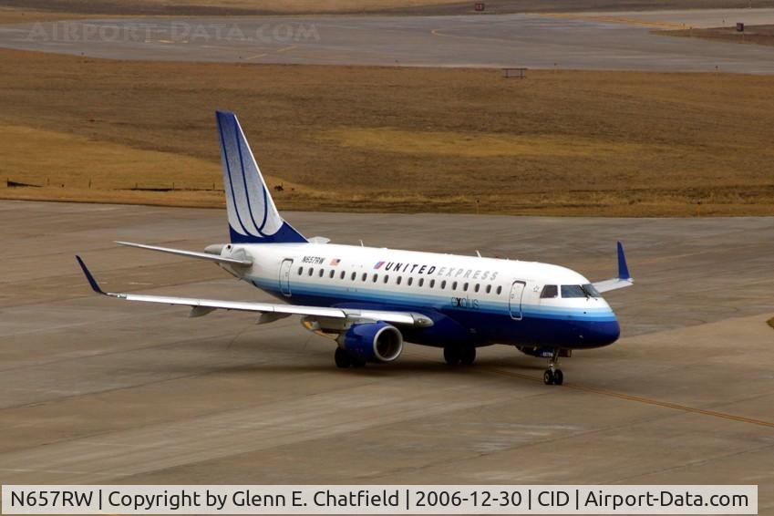 N657RW, 2005 Embraer 170SE (ERJ-170-100SE) C/N 17000115, Taxiing out for departure, seen from the tower on an overcast day