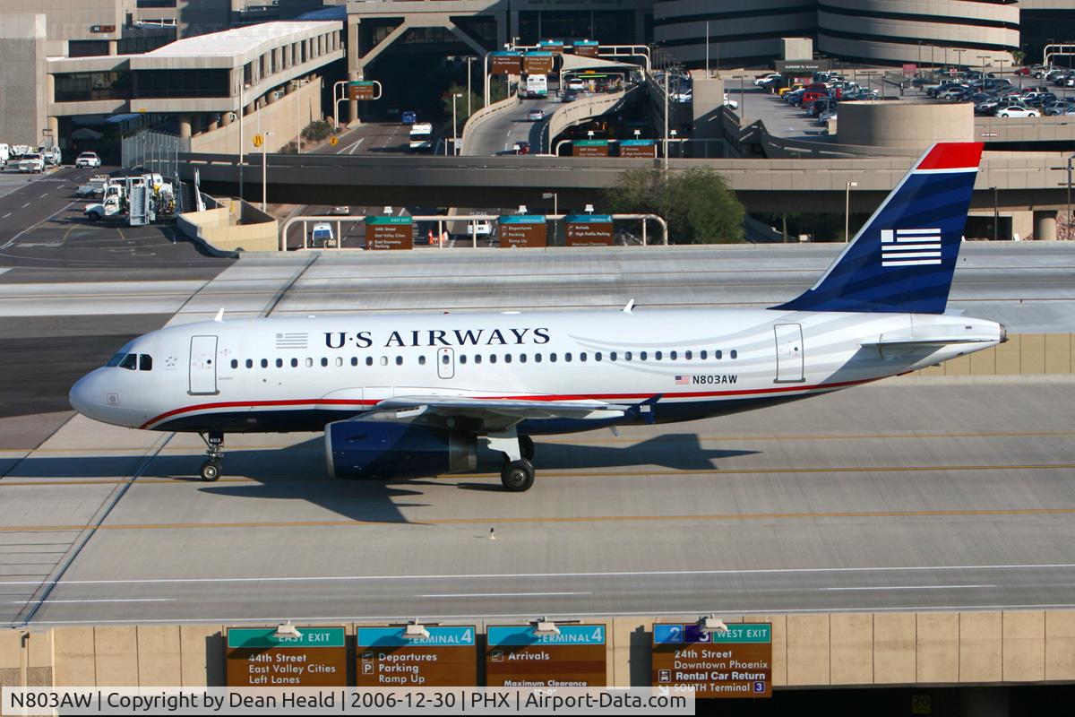 N803AW, 1998 Airbus A319-132 C/N 0931, US Airways (America West) N803AW taxiing across the bridge to the gate after arrival on the South Complex.