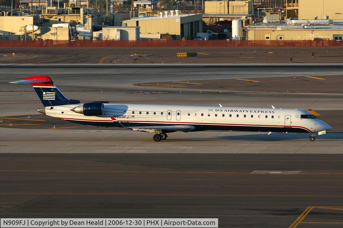 N909FJ, 2003 Bombardier CRJ-900ER (CL-600-2D24) C/N 15009, US Airways Express (Mesa Airlines) N909FJ (FLT ASH2864) taxiing to the gate after arrival on RWY 26 from Memphis Int'l (KMEM).
