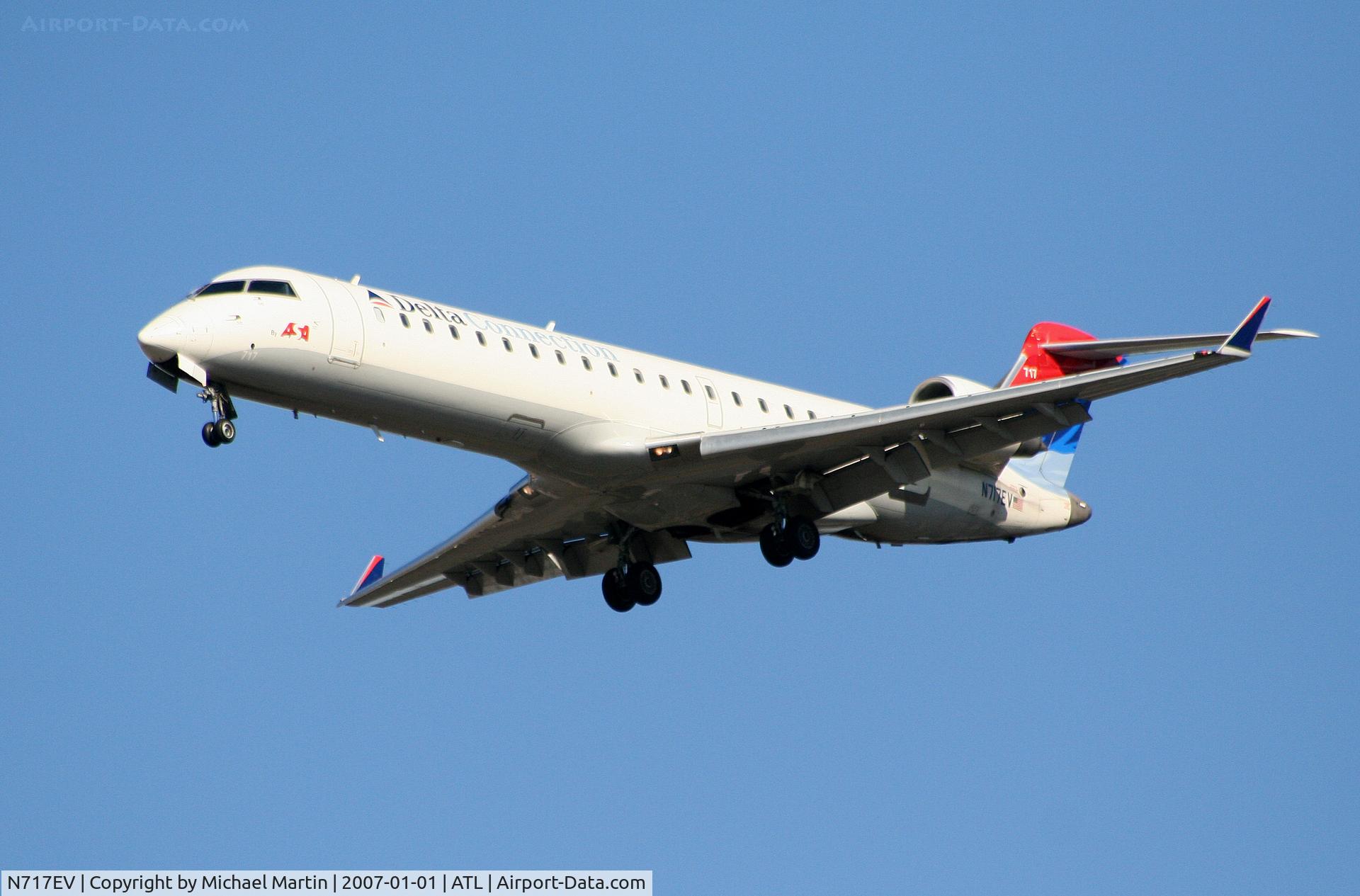 N717EV, 2003 Bombardier CRJ-701 (CL-600-2C10) Regional Jet C/N 10088, On final for Runway 26L