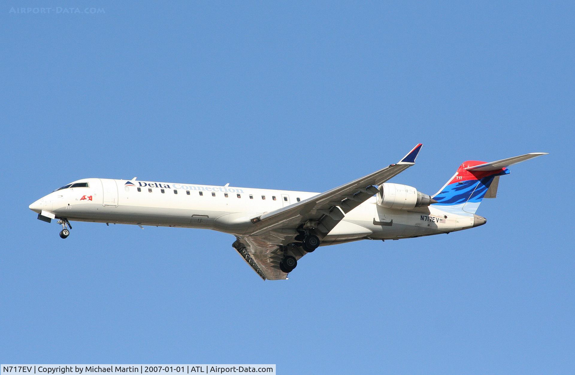 N717EV, 2003 Bombardier CRJ-701 (CL-600-2C10) Regional Jet C/N 10088, On final for Runway 26L