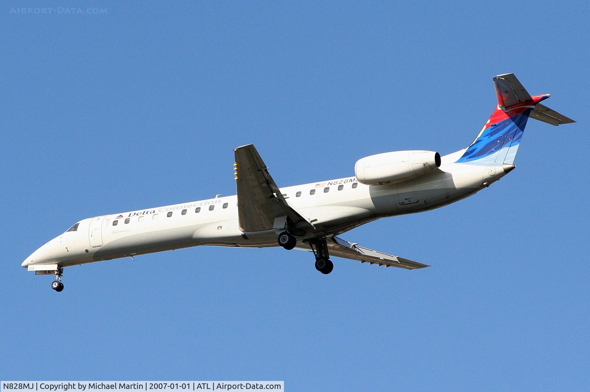 N828MJ, 2000 Embraer EMB-145LR C/N 145218, Over the numbers of 26L