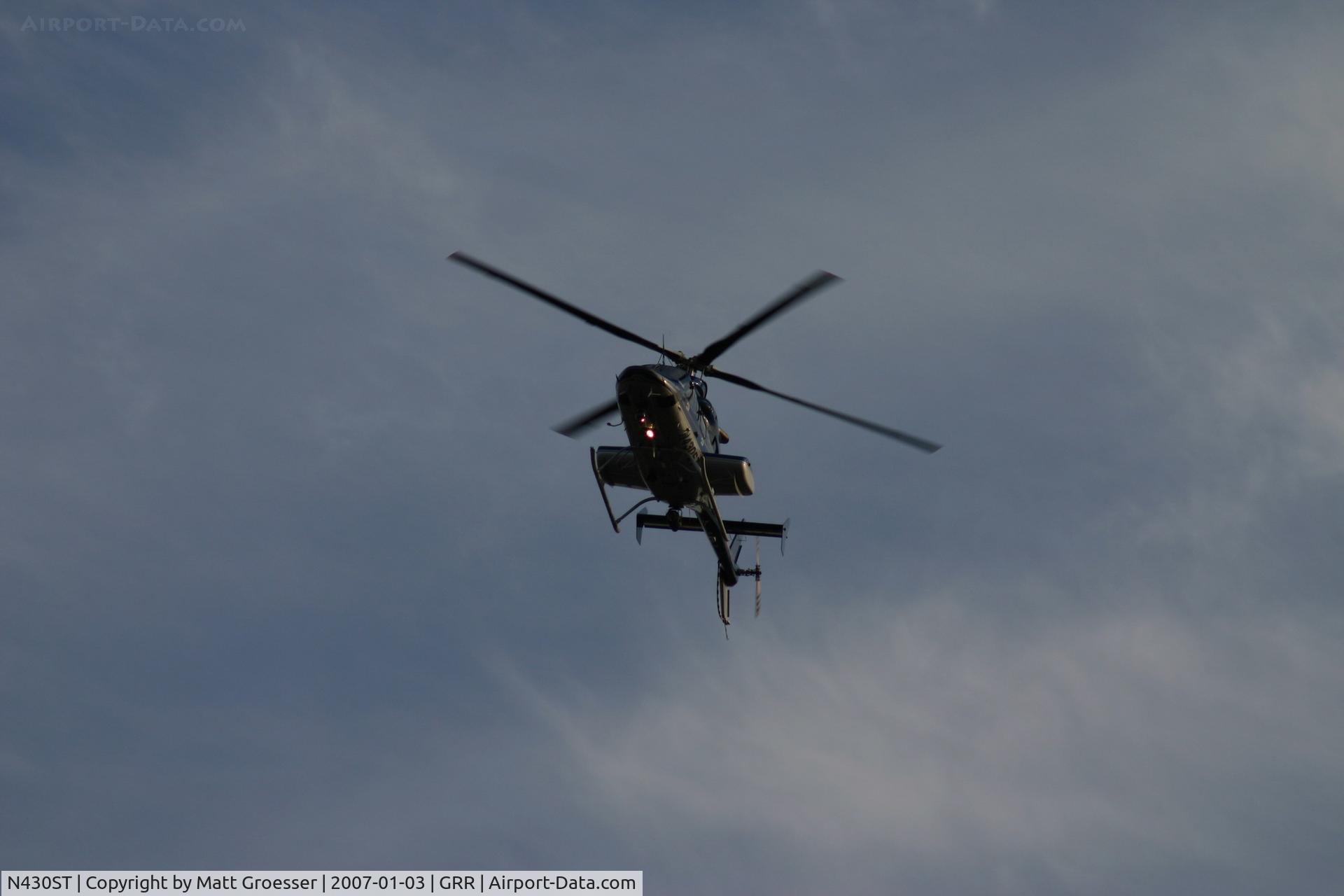 N430ST, 2000 Bell 430 C/N 49071, MSP helicopter over Grand Rapids, MI for Gerald R. Ford funeral security detail