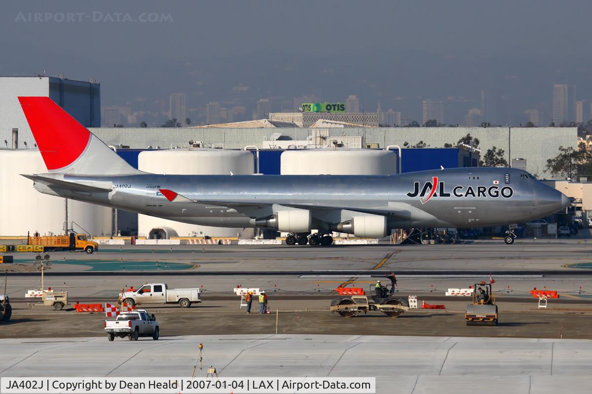 JA402J, 2004 Boeing 747-446F C/N 33749, JAL Cargo JA402J taxiing to the cargo terminal after arrival on the North complex.