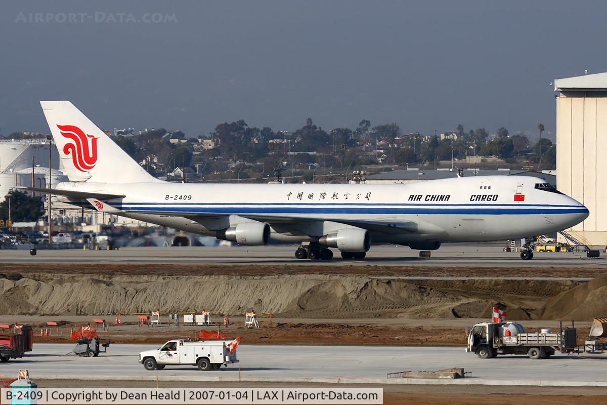 B-2409, Boeing 747-412F/SCD C/N 26560, Air China Cargo B-2409 (FLT CCA1057) taxiing to the cargo terminal after arrival on the North complex from Shanghai Pudong (ZSPD).