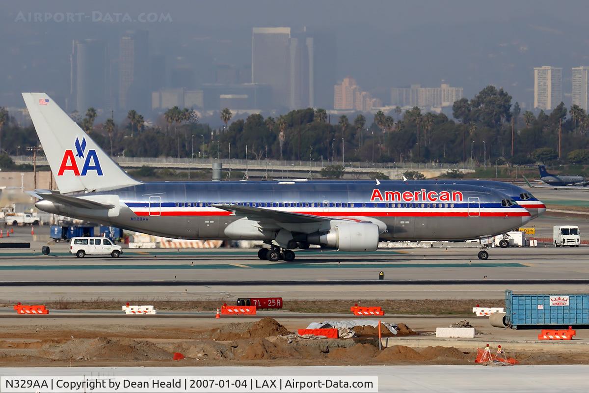 N329AA, 1987 Boeing 767-223 C/N 22329, American Airlines N329AA (767-223) in the foreground, with American Airlines N379AA (767-323ER) just behind it.