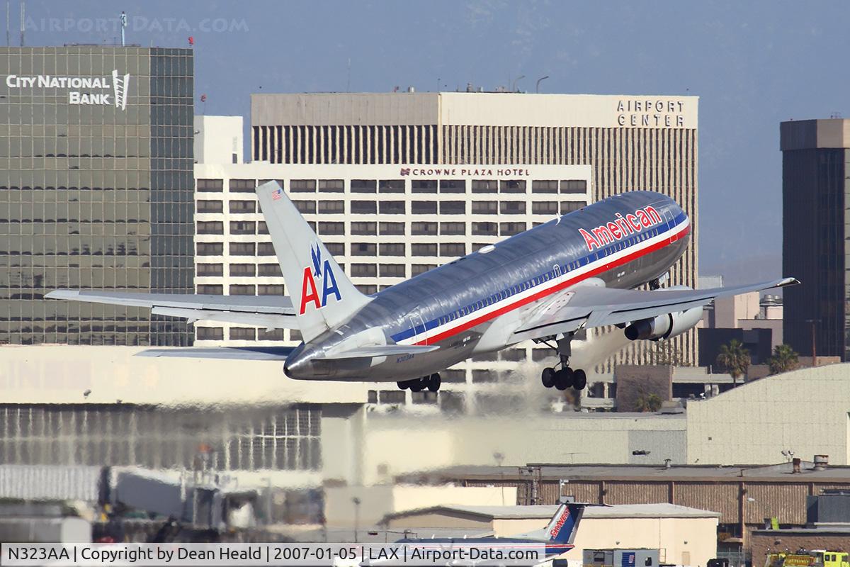 N323AA, Boeing 767-223 C/N 22324, American Airlines N323AA (FLT AAL4) climbing out from RWY 7L enroute to John F Kennedy Int'l (KJFK).