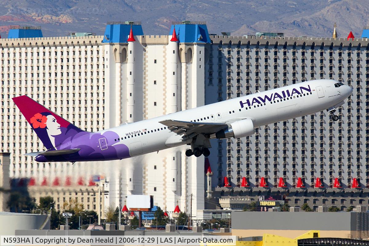 N593HA, 2003 Boeing 767-33A C/N 33424, Hawaiian Airlines N593HA (FLT HAL7) climbing out from RWY 01R, in front of the Excalibur Hotel & Casino, enroute to Honolulu Int'l (PHNL).
