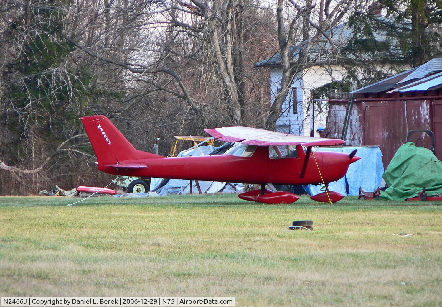 N2466J, 1966 Cessna 150G C/N 15065566, Almost blending in with the main airport building was this hot little 1966 Cessna 150.