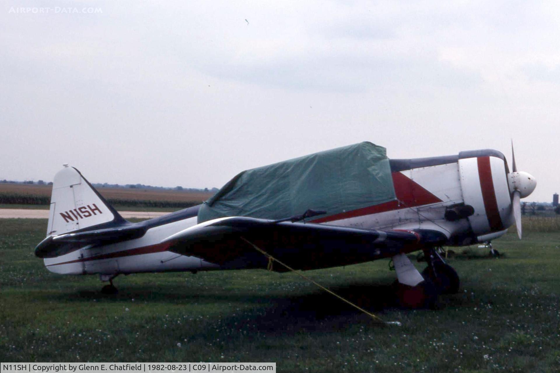 N11SH, 1947 North American SNJ-5 Texan C/N 84851, Tucked away on a rainy day