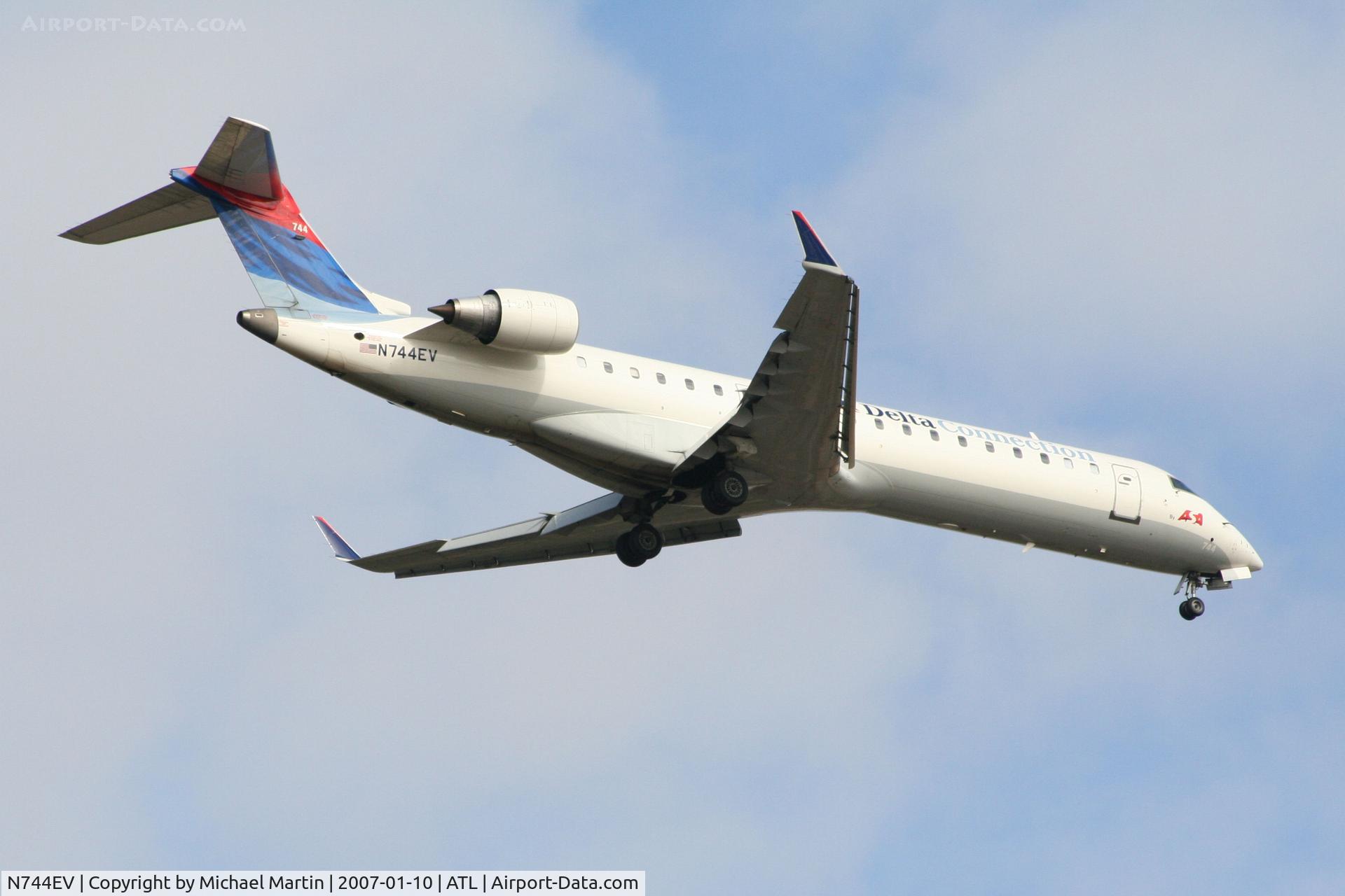 N744EV, 2004 Canadair CRJ-700 (CL-600-2C10) Regional Jet C/N 10157, Over the numbers of 9R