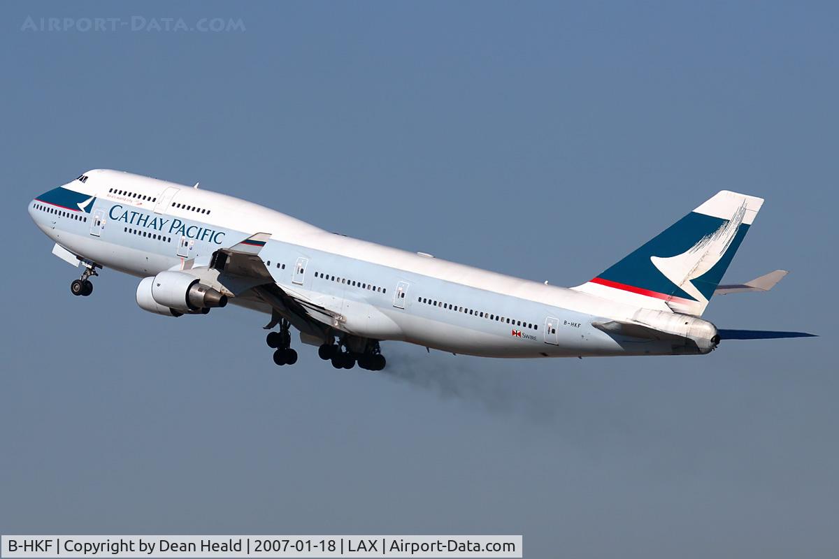 B-HKF, Boeing 747-412 C/N 25128, Cathay Pacific B-HKF (FLT CPA885) climbing out from RWY 25R, trailing brake dust, enroute to Hong Kong Int'l (VHHH).
