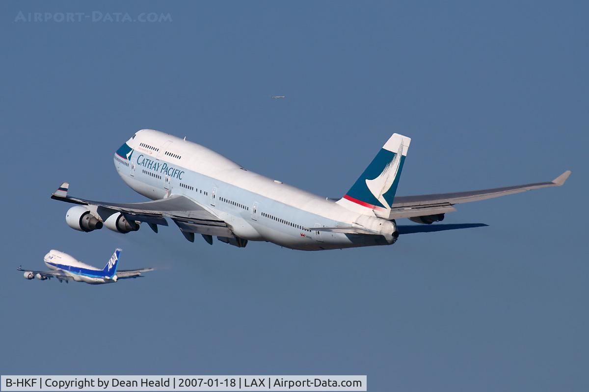 B-HKF, Boeing 747-412 C/N 25128, Cathay Pacific B-HKF (FLT CPA885) climbing out from RWY 25R enroute to Hong Kong Int'l (VHHH), while ANA5 climbs out from RWY 24L enroute to Narita Int'l (RJAA).