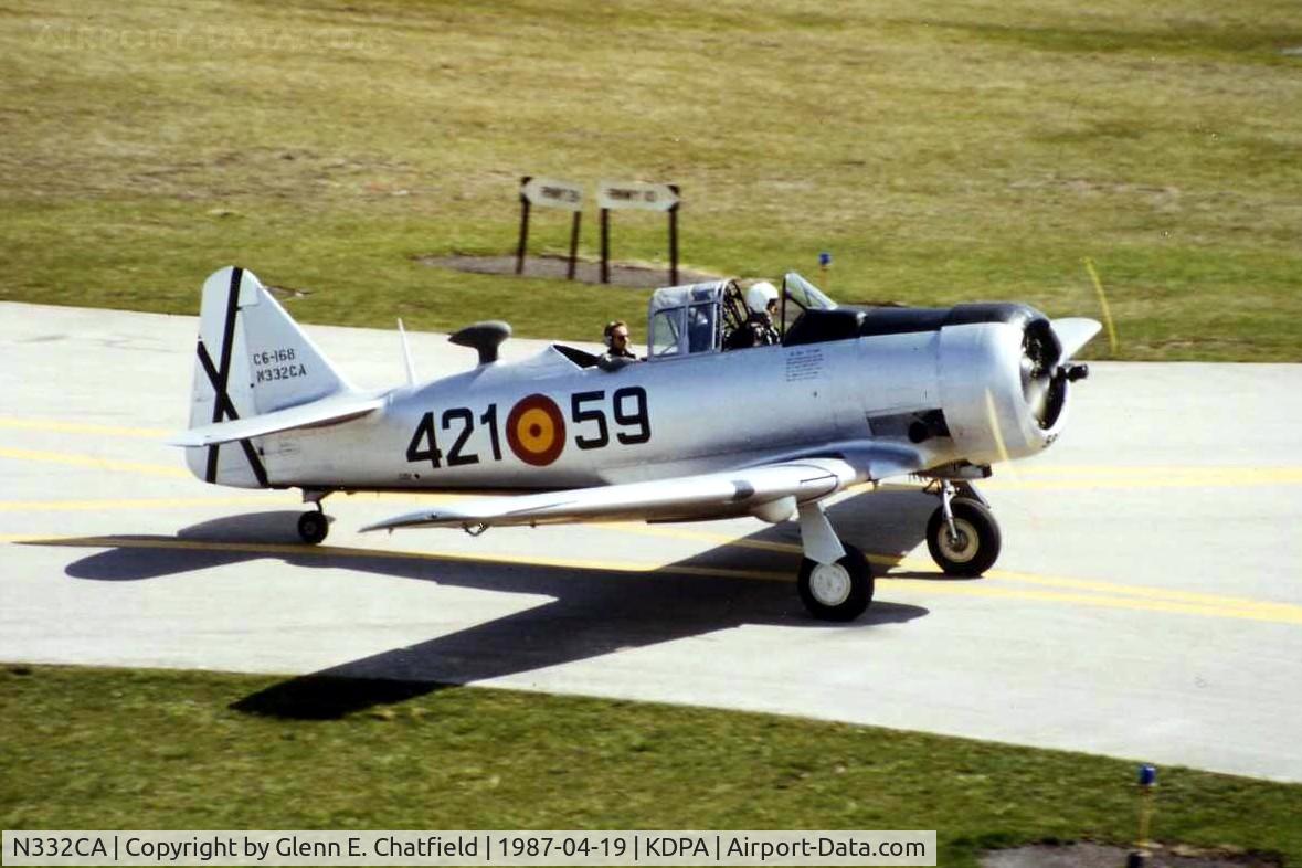 N332CA, 1944 North American T-6G Texan C/N 168-409, Taxiing by the control tower
