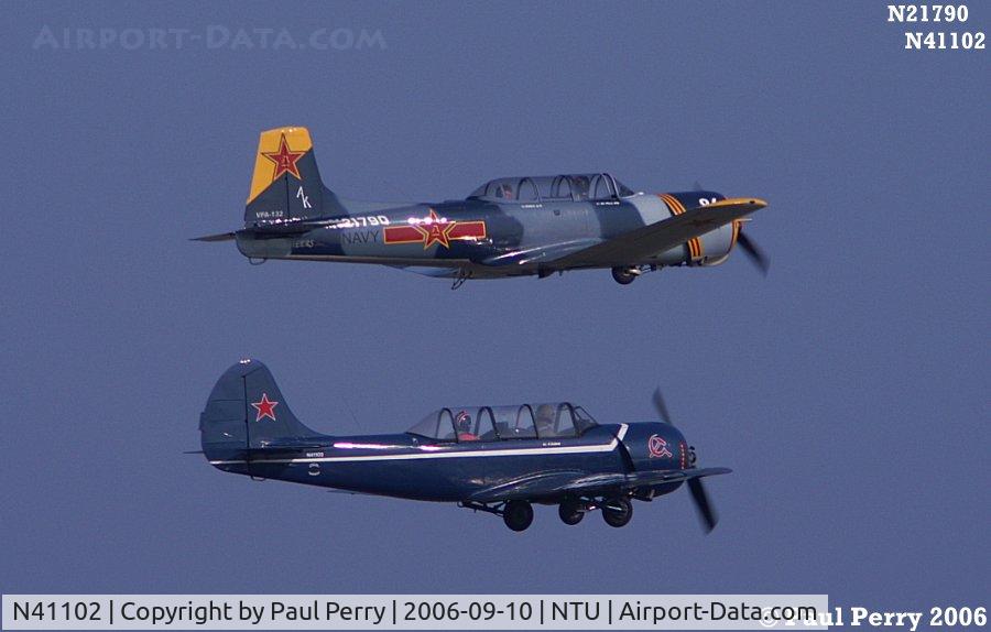 N41102, 1986 Yakovlev Yak-52 C/N 866508, In formation with a Nanchang