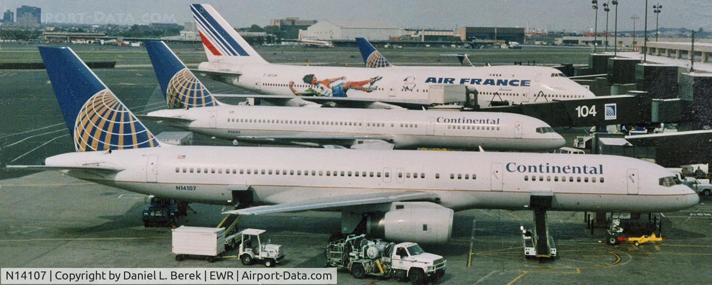 N14107, 1994 Boeing 757-224 C/N 27297, A Continental 757-224 joins other interesting aircraft at Newark's Terminal C in 1999.
