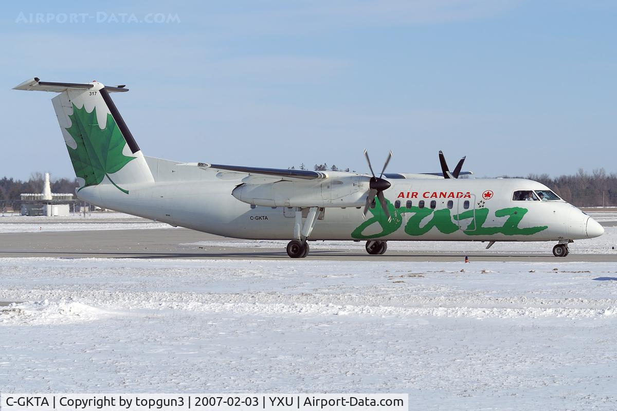 C-GKTA, 1989 De Havilland Canada DHC-8-301 Dash 8 C/N 124, Taxiing on Golf