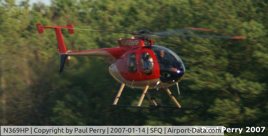 N369HP, McDonnell Douglas 369E C/N 0232E, Coming in low over the active runway in Suffolk
