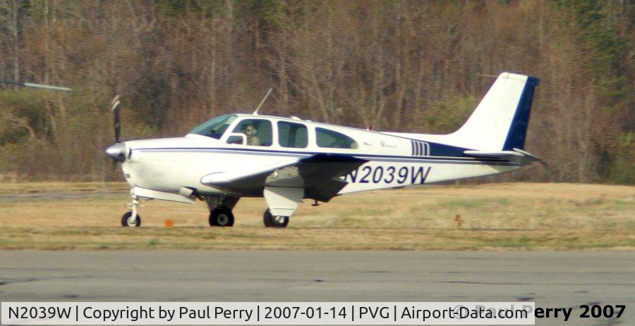 N2039W, 1965 Beech 35-C33 Debonair C/N CD-969, Down and about to turn off the active runway