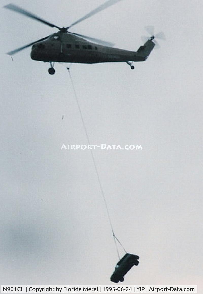 N901CH, 1962 Sikorsky S-58T C/N 58-1464, Sikorsky S-58 lifting a little car before dropping it at Airshow