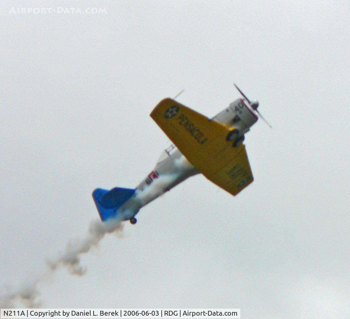 N211A, 1958 North American SNJ-6 Texan C/N 121-42318, This classic 1958 Navy trainer is seen in a spectacular performance at the 2006 Mid Atlantic Air Museum WW II Weekend air show.