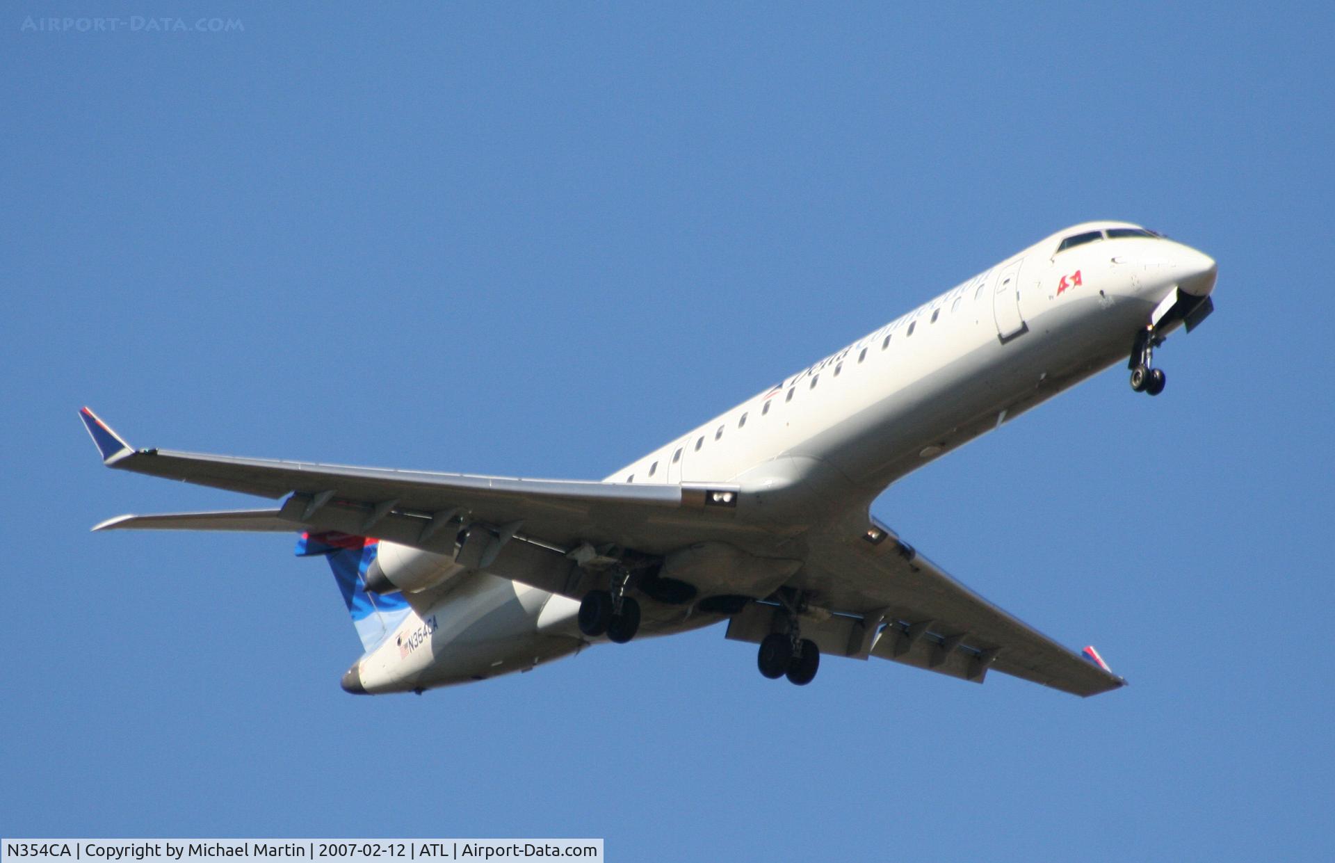 N354CA, 2002 Bombardier CRJ-701ER (CL-600-2C10) Regional Jet C/N 10064, On final for Runway 9R