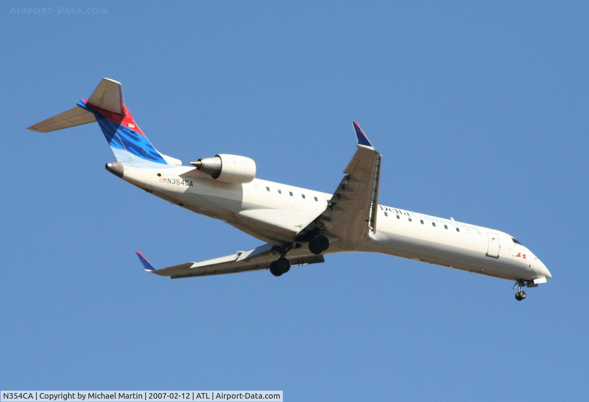 N354CA, 2002 Bombardier CRJ-701ER (CL-600-2C10) Regional Jet C/N 10064, Over the numbers of 9R