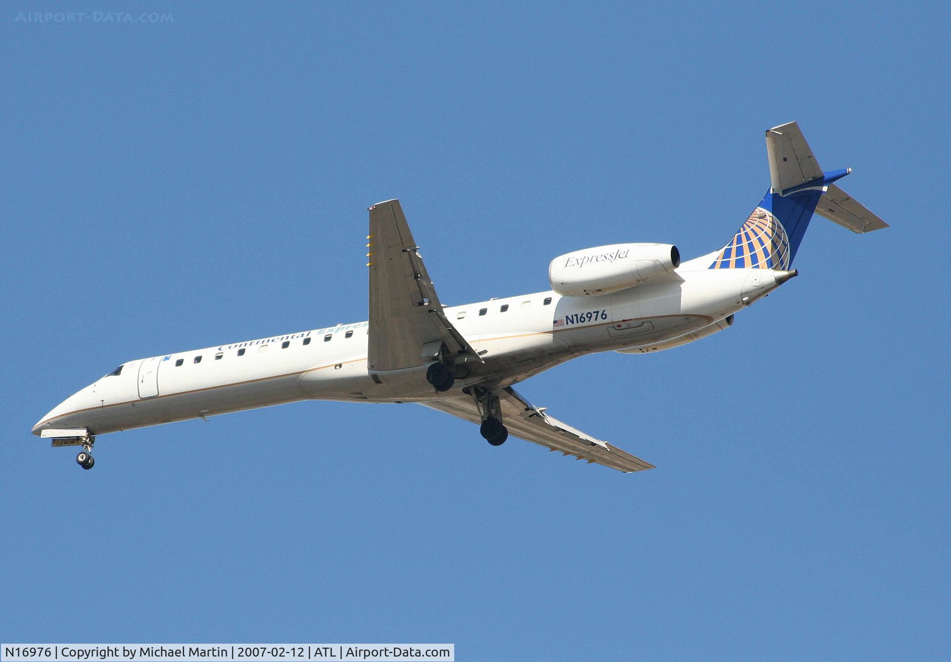 N16976, 1999 Embraer EMB-145LR C/N 145171, Over the numbers of 26L