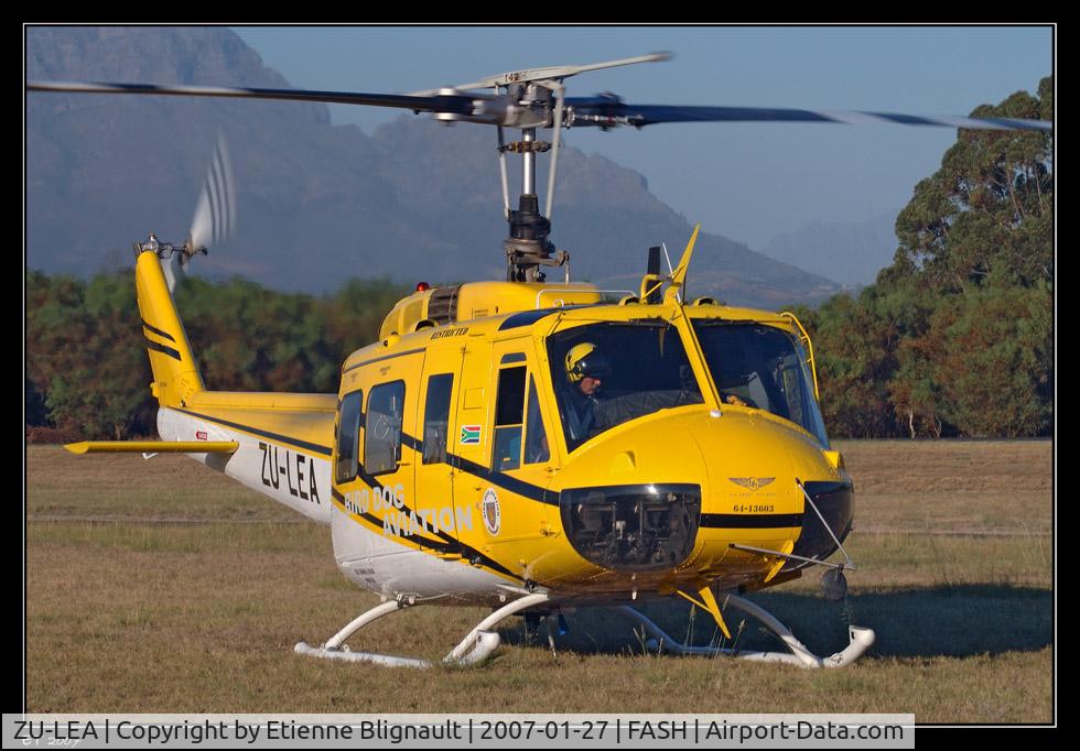 ZU-LEA, Bell UH-1H Iroquois C/N 4310, ZU-LEA flew in for one day only at FASH (Stellenbosch Flying Club) and I managed to catch her during departure. Here is the pilot and proud owner, Mark Jackson, busy with final checks before take-off. He is currently stationed at Tulbagh in the Western Ca