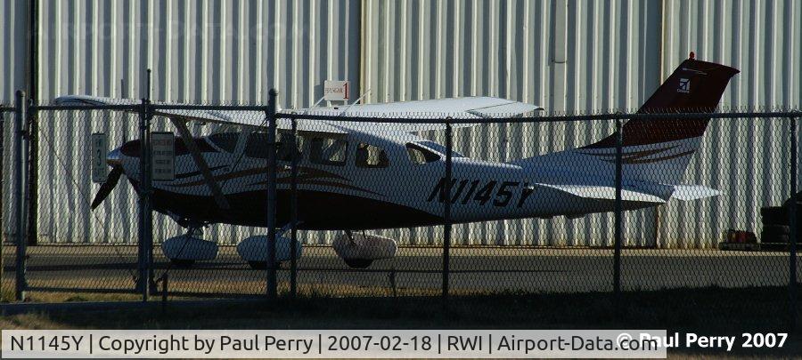 N1145Y, 2006 Cessna 206H Stationair C/N 20608280, Sequestered behind the fence