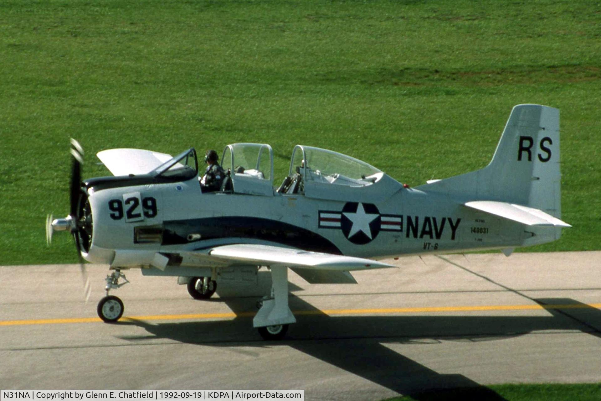 N31NA, 1954 North American T-28B C/N 140031, Taxiing by the control tower