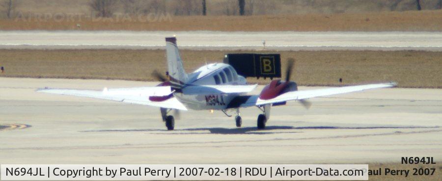 N694JL, Raytheon Aircraft Company G58 Baron C/N TH-2160, Taxiing out amidst the big boys in Raleigh