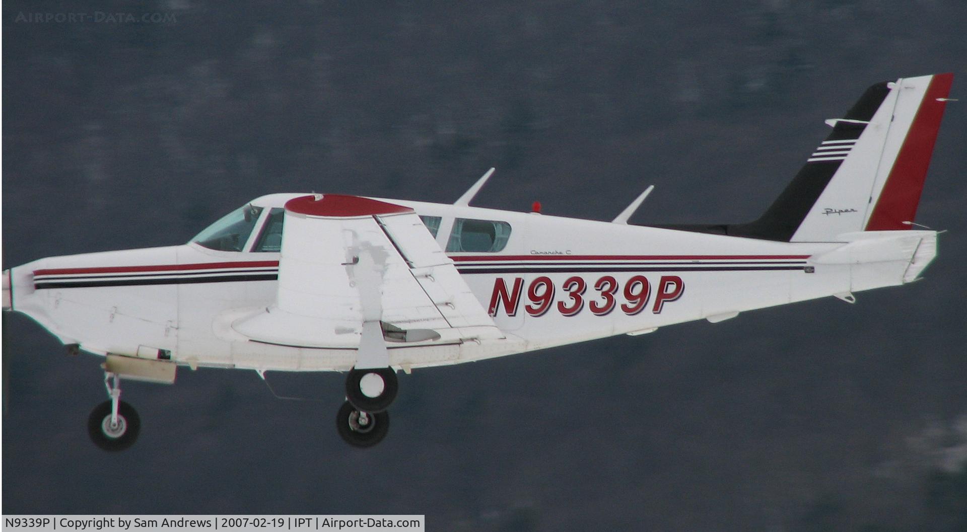 N9339P, 1969 Piper PA-24-260 Comanche C/N 24-4837, When they're flying by and just above the runway and your fingers are screaming from the cold it is a bit tough sometimes to get the whole plane in shot.   I was pretty close on this one.