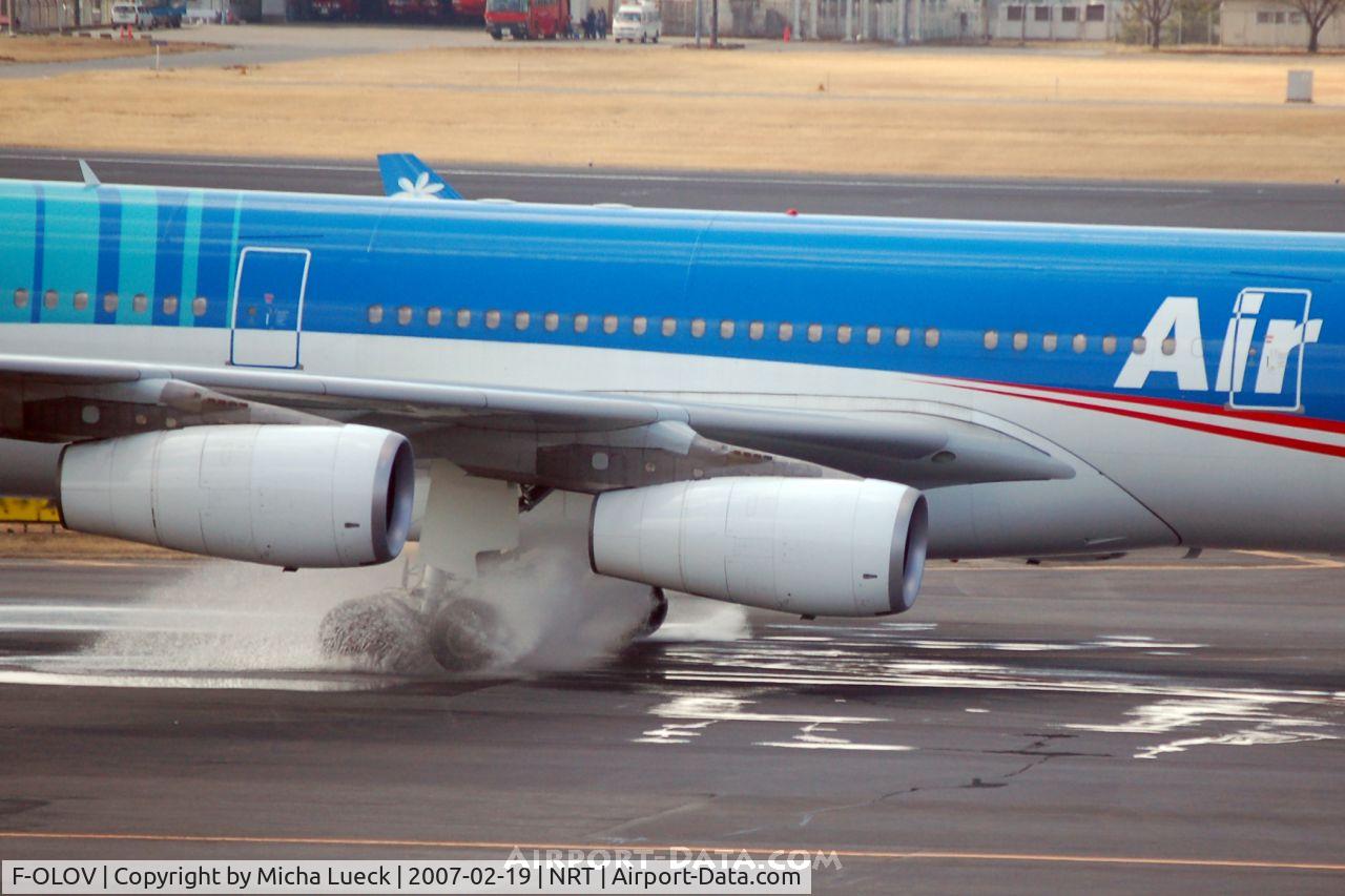 F-OLOV, 2005 Airbus A340-313 C/N 668, Big puddle on the taxiway