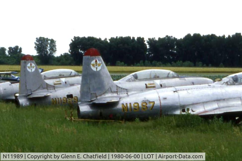 N11989, 1953 Lockheed T-33A Shooting Star C/N 580-9712, T-33A 53-6091, when it was derelict, behind another T-33.  Became N8077X, N32GB, OY-RUT, N132GB