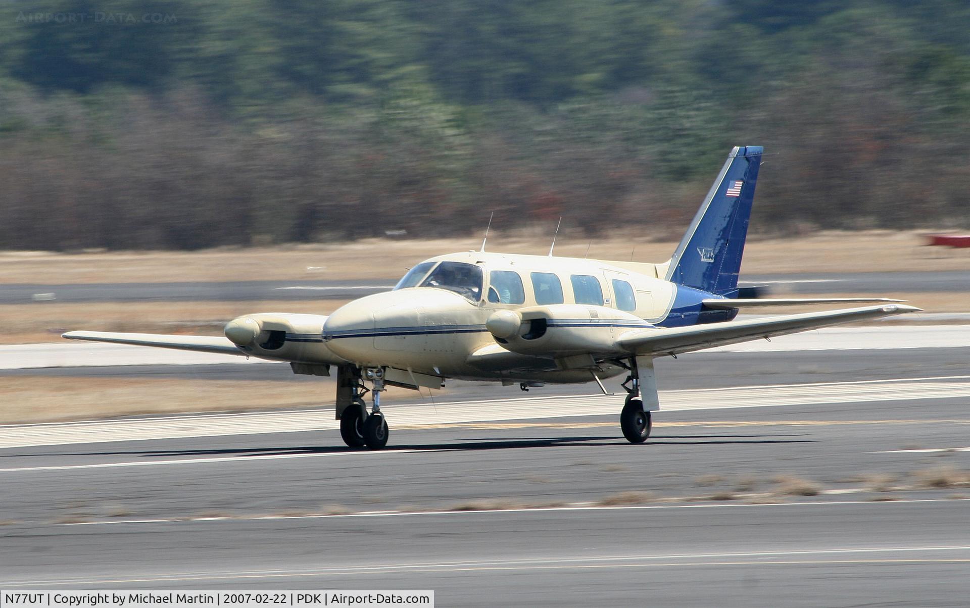 N77UT, 1975 Piper PA-31-310 Navajo C/N 31-7512036, Taking off from Runway 34