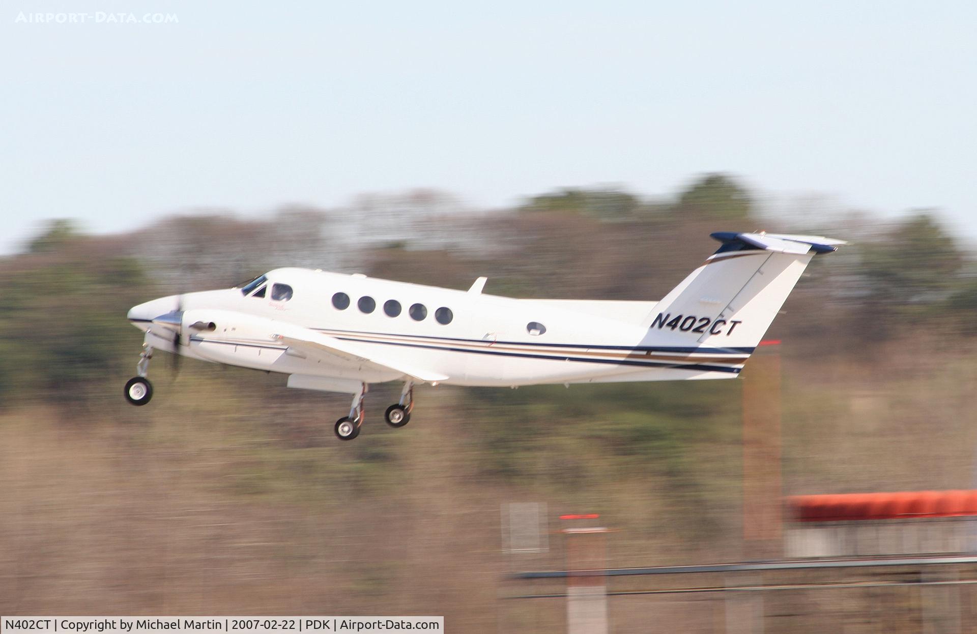 N402CT, Raytheon B200 King Air C/N BB-1929, Departing PDK enroute to EKM